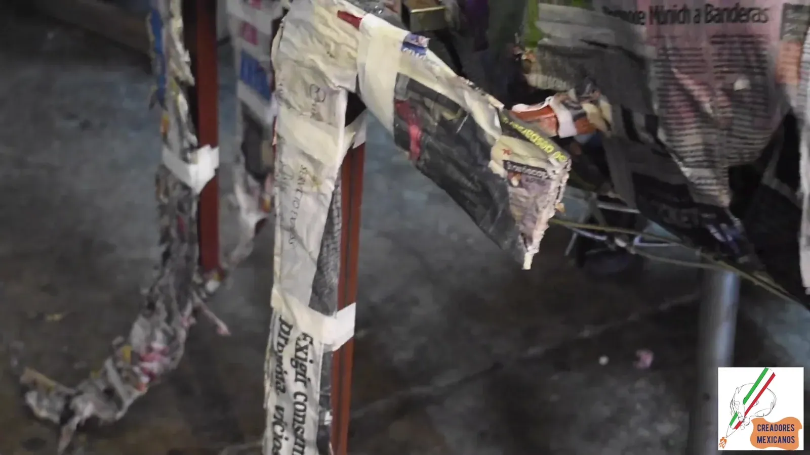 Layers of newspaper pasted over the armature of a monumental piece.